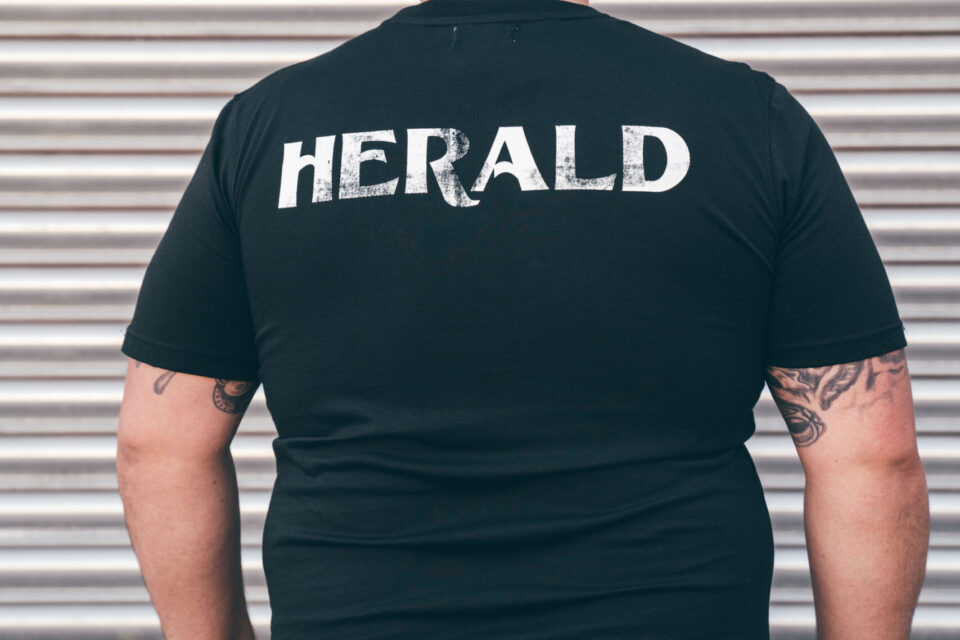 Herald Brand Logo Tee – Black - Image 4